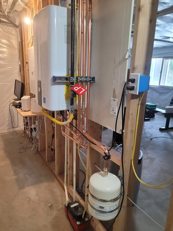 Licensed plumber repairing a kitchen sink in Wallington